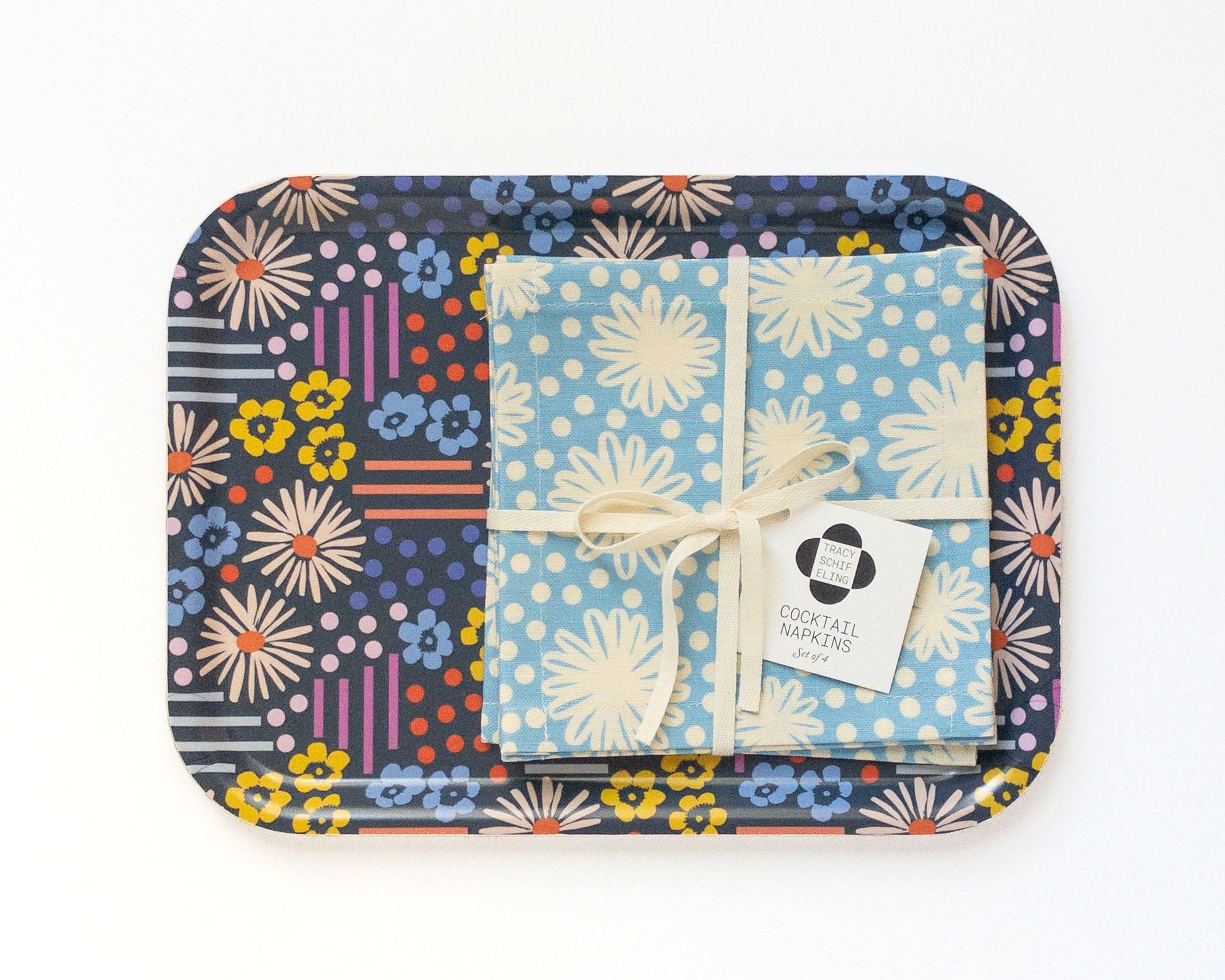 Colorful floral-patterned tray with a set of cocktail napkins on a white background