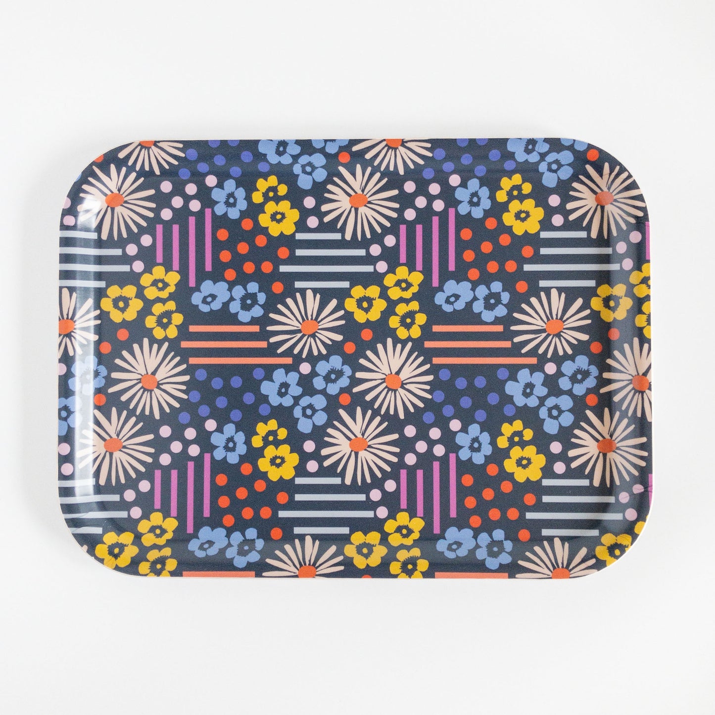 Colorful floral and geometric patterned tray on a white background.