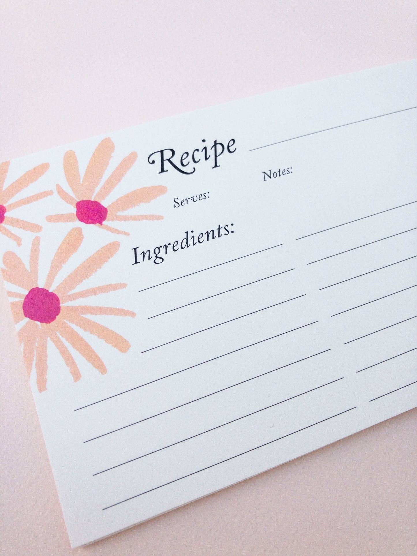 Recipe card with floral design on a light pink background