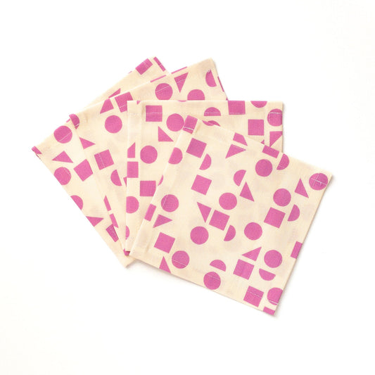 Set of four cocktail napkins with purple geometric pattern on a white background