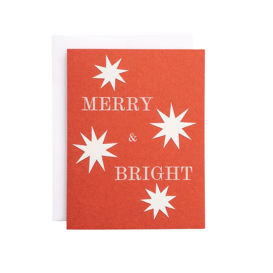 Red card with white stars and 'Merry & Bright' text on a white background
