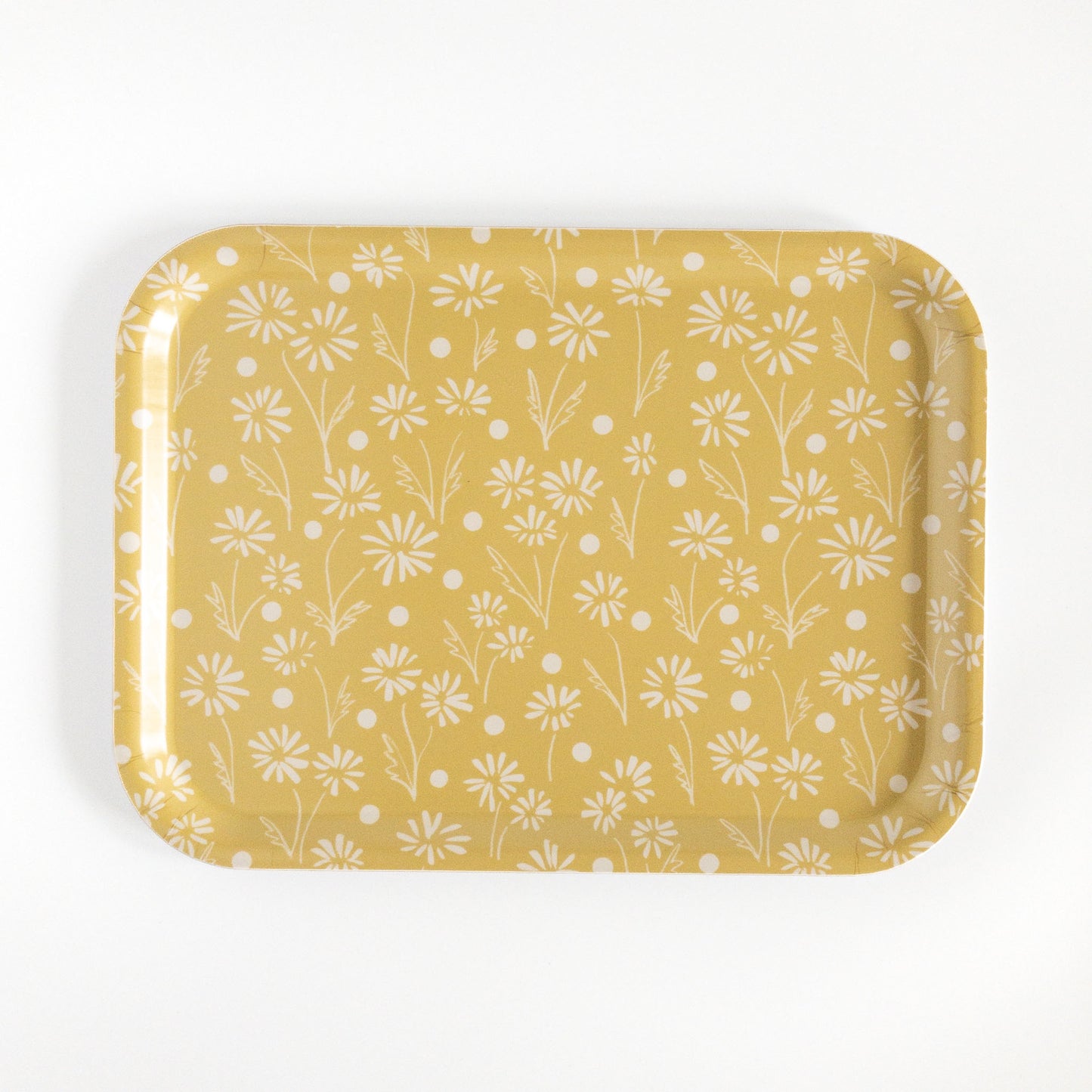 Yellow daisy tray on a white background.
