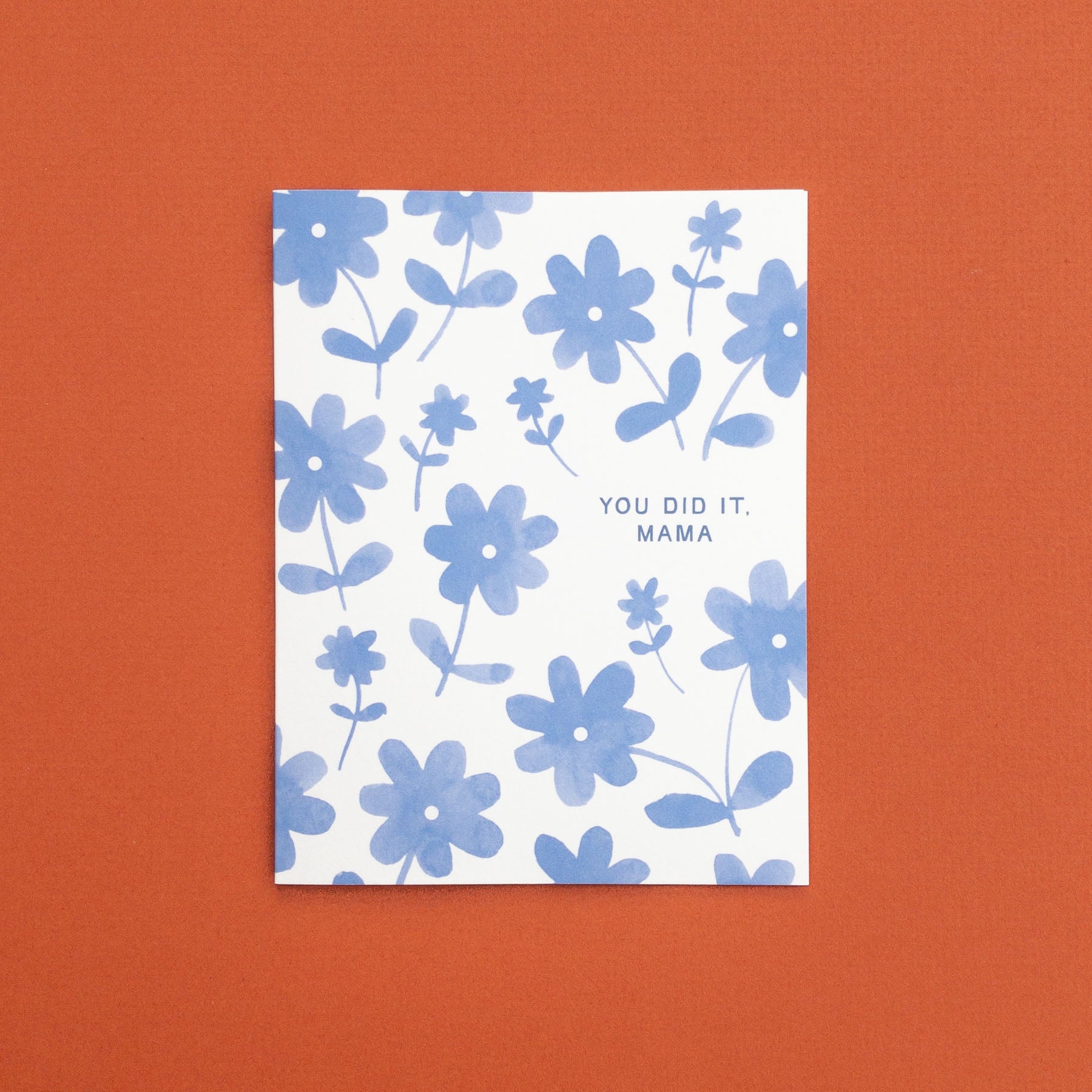 Greeting card with blue floral pattern and 'YOU DID IT, MAMA' text 
