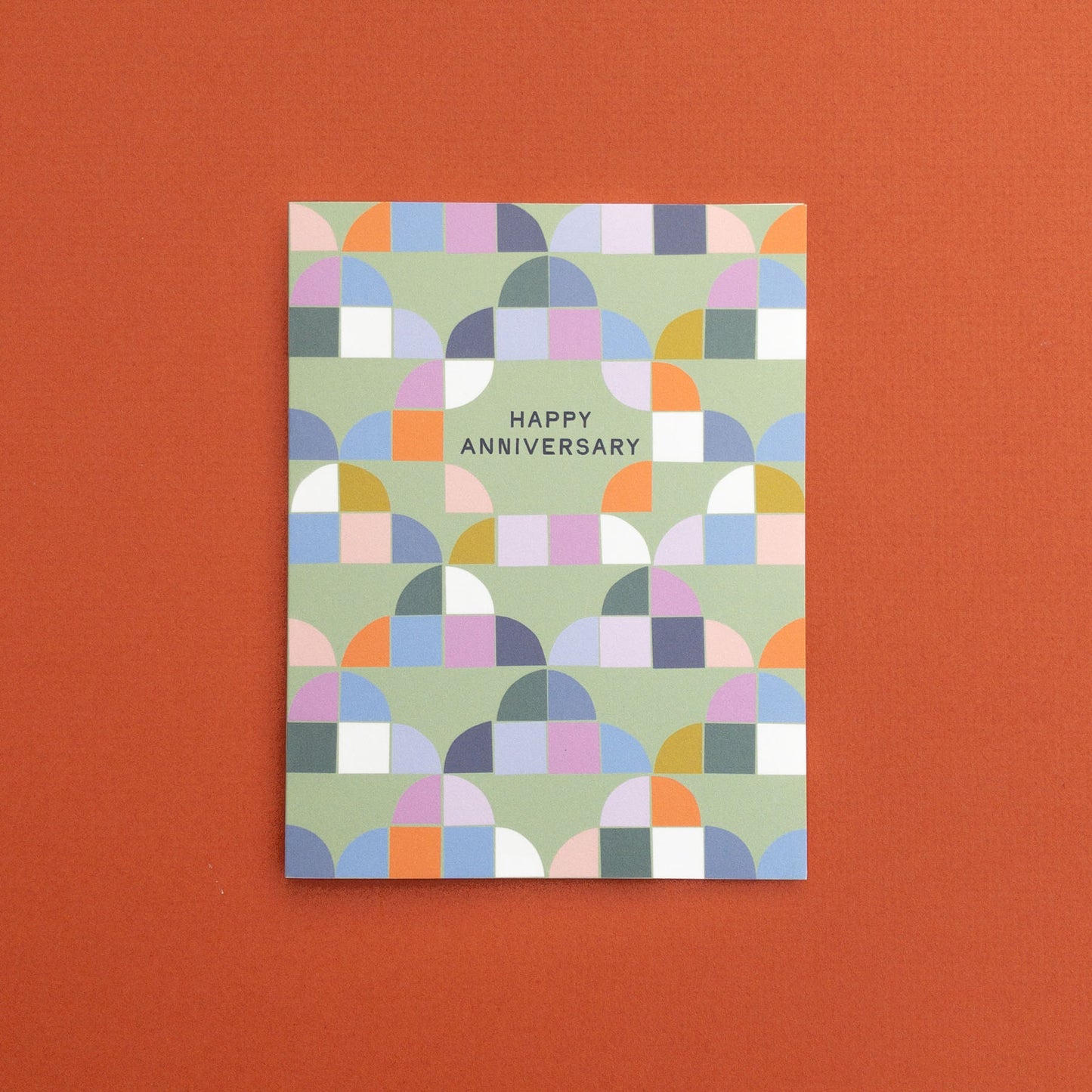 Colorful geometric patterned card with 'Happy Anniversary' text