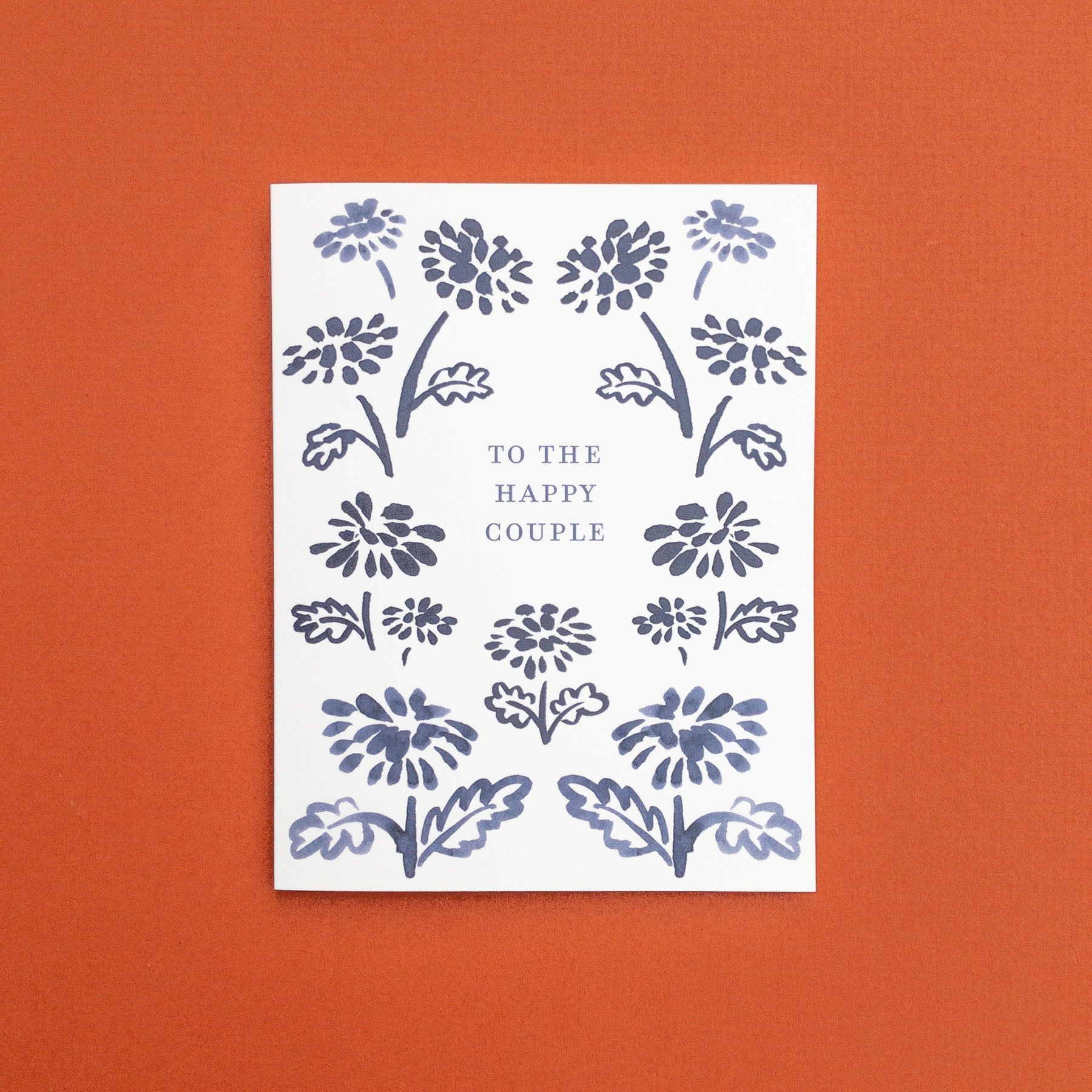 Wedding greeting card with navy floral border design and 'To the Happy Couple' text.