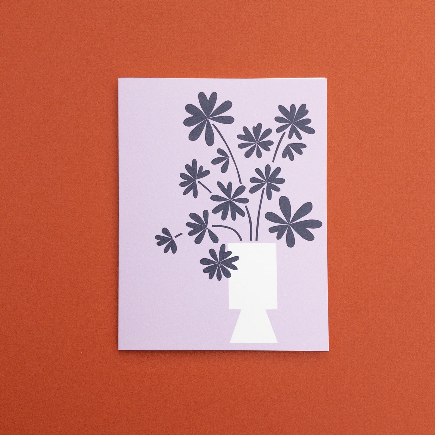 Botanical greeting card with floral design on a purple background