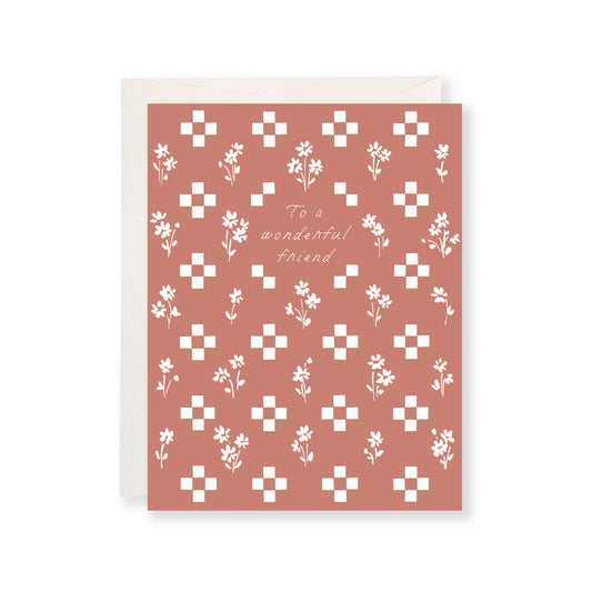 Greeting card with floral pattern and "To a wonderful friend" text on a white background
