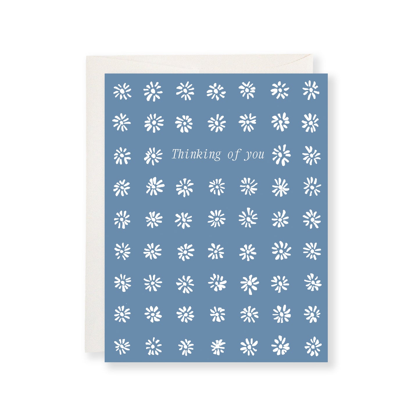 Blue card with white floral pattern and 'Thinking of you' text on a white background