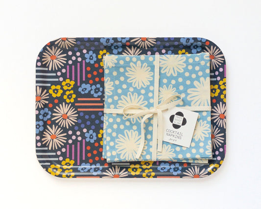Colorful floral-patterned tray with a set of cocktail napkins on a white background