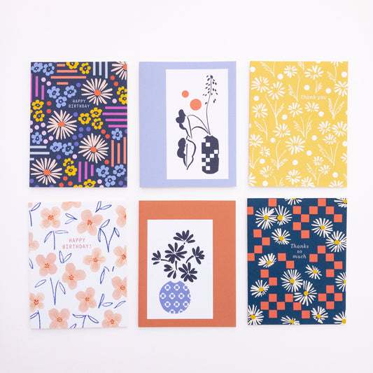 Set of six colorful greeting cards with various patterns on a white background