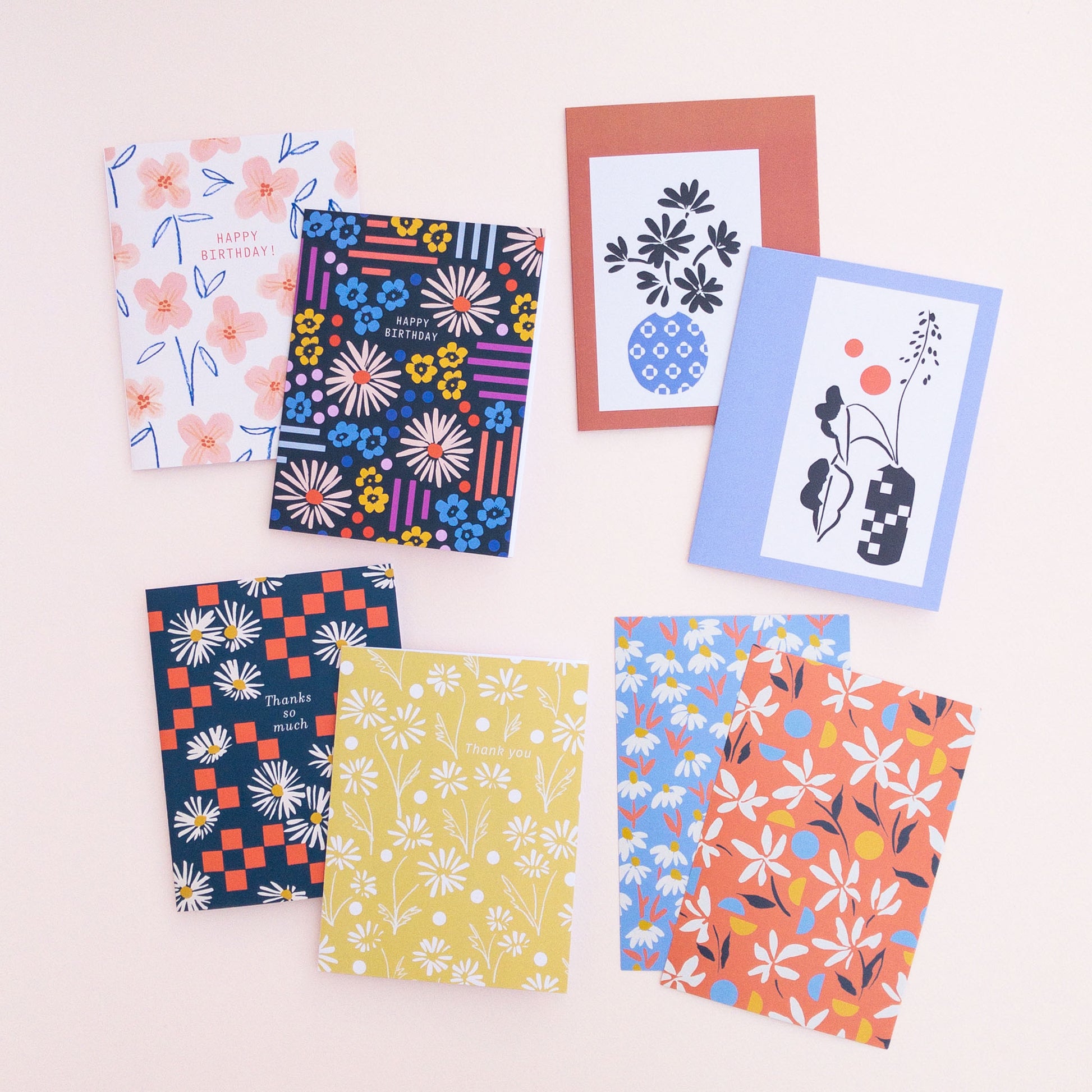 8 floral cards arranged on a light pink background.
