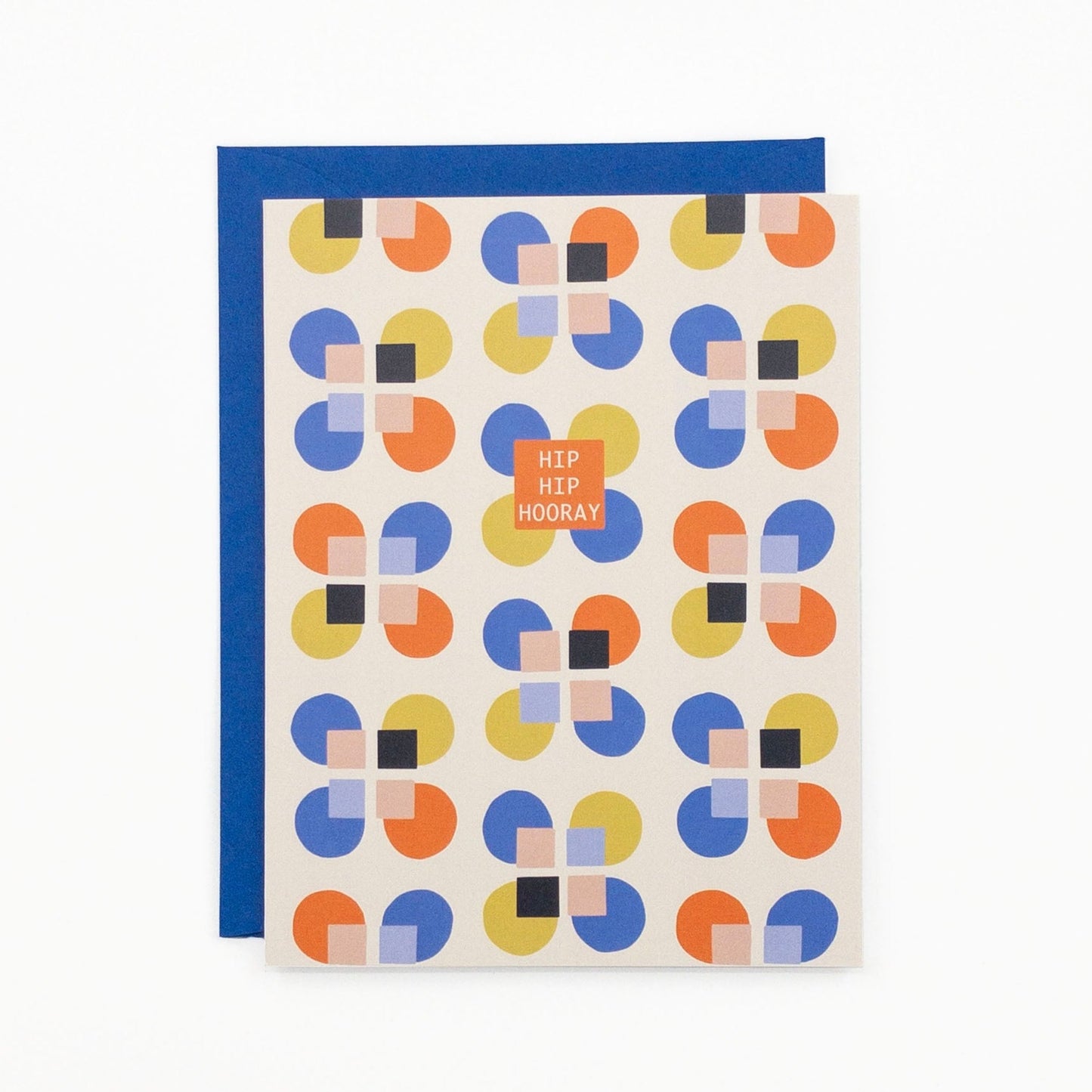 Greeting card featuring primary colored geometric pattern and the message "Hip hip hooray".