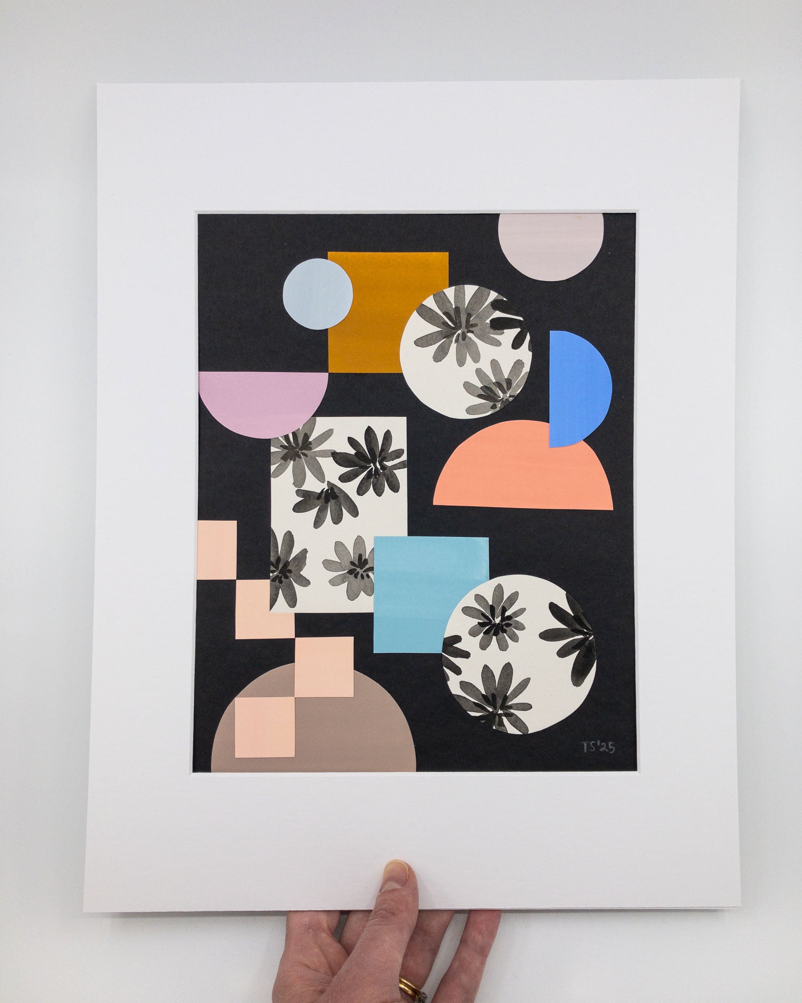 Geometric collage of colored shapes on a black background.