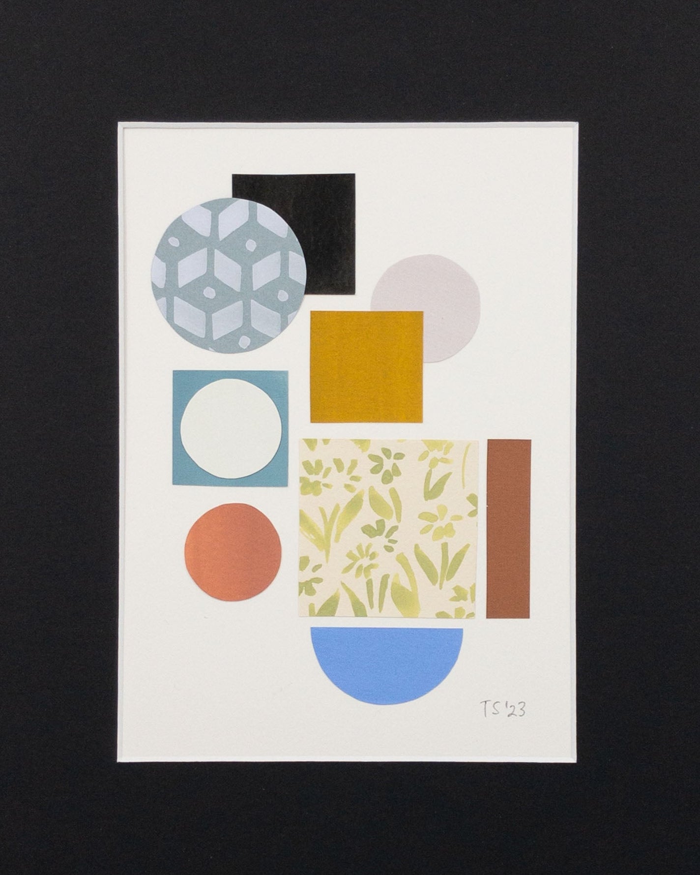 Colorful collage of circles and squares in a black mat.