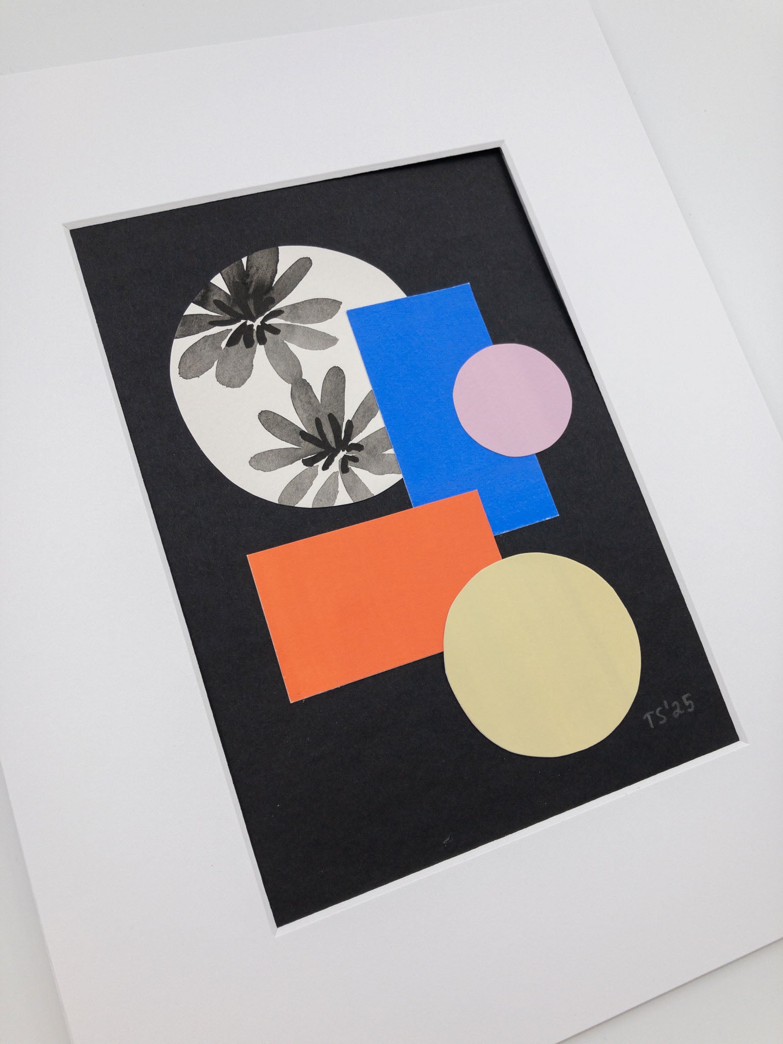Angled photo of a colorful geometric collage.
