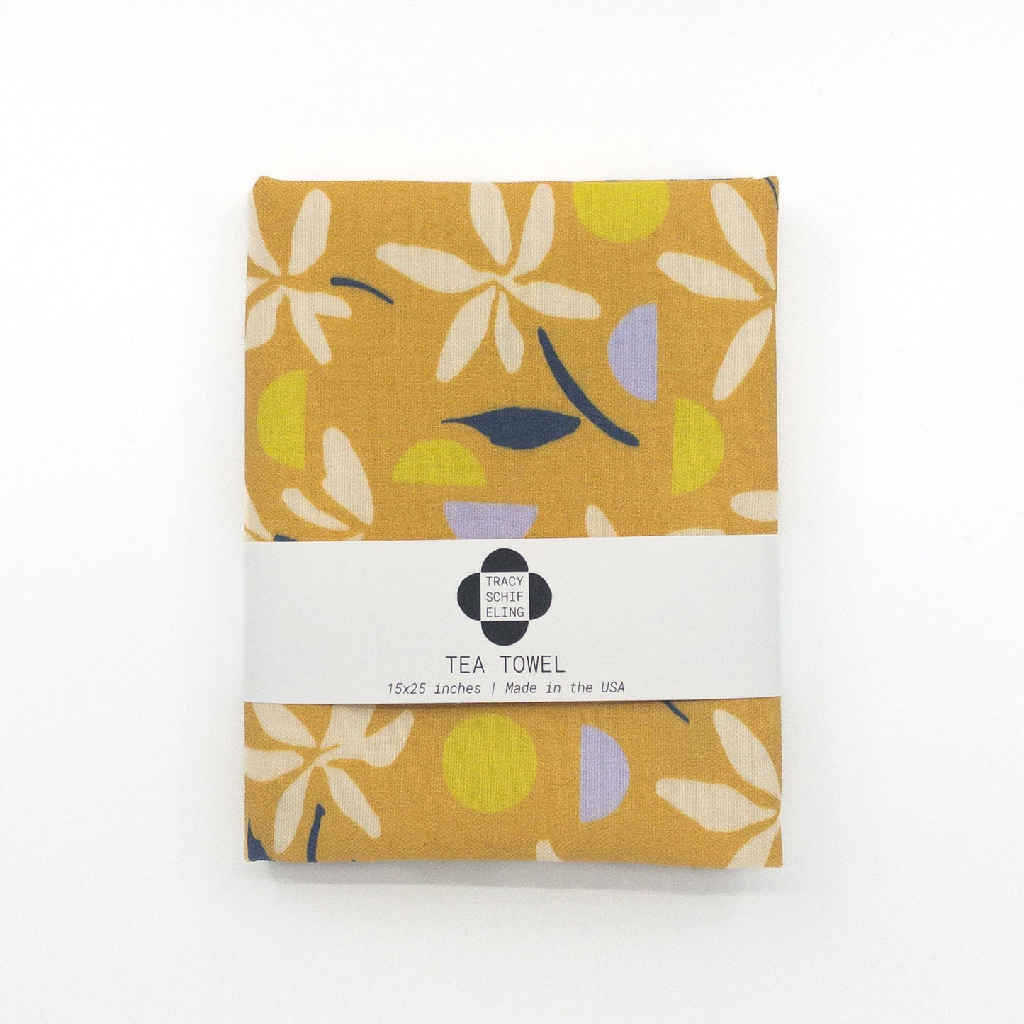 Folded and packaged yellow floral tea towel.